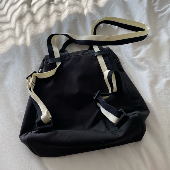 Kate spade nylon black back pack with stripped straps